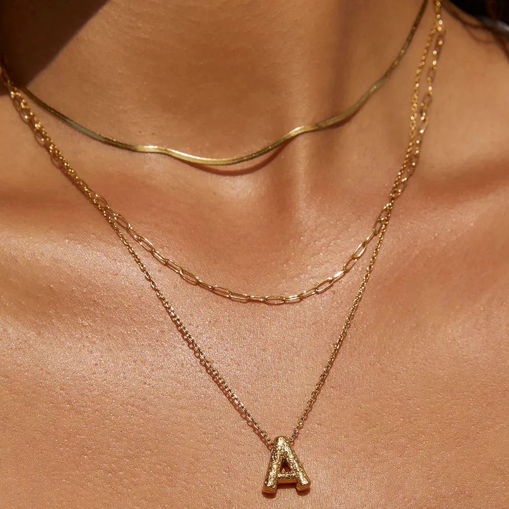 Arms of Eve Statement Letter Necklace - Gold